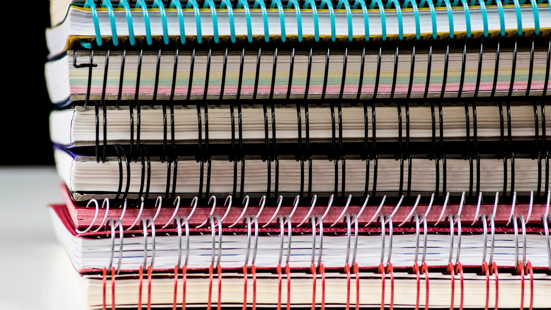 Stack of spiral bound books