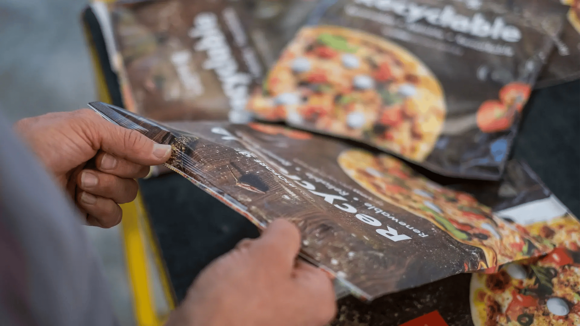 Person Grabbing a Frozen Food Package